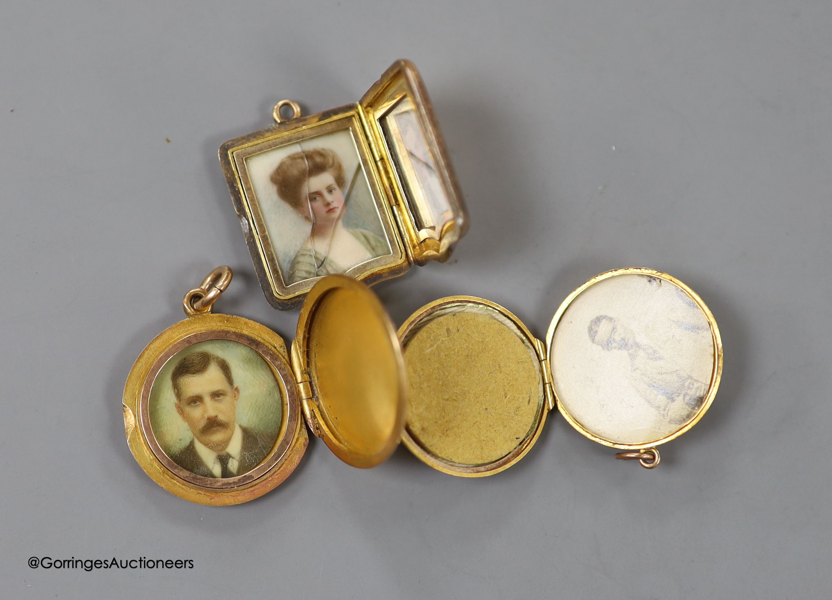 Three early 20th century yellow metal lockets, one stamped 9ct gold, all with engraved name or monogram, largest 24mm, gross weight 22.1 grams.